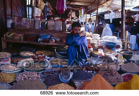 Portrait of market vendor sitting at market stall, Islamabad, Pakistan View Large Photo Image Stock Photograph - Portrait of market vendor sitting at market stall, Islamabad, Pakistan . Fotosearch