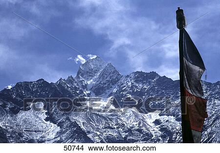 Picture - Prayer flag with mountains in background, Himalayas, Khumbu, Nepal . Fotosearch