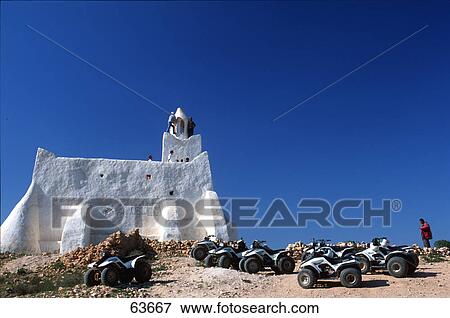 Quad bikes parked in front of mosque, Guellala, Tunisia View Large Photo Image Stock Photo - Quad bikes parked in front of mosque, Guellala, Tunisia . Fotosearch
