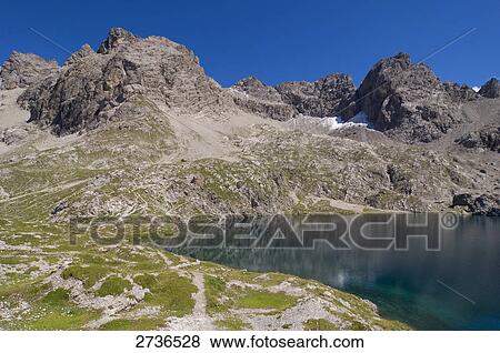 Reflection of mountain in lake, Laserzsee, Lienzer Dolomiten, Tyrol, Austria  View Large Photo Image Stock Photo - Reflection of mountain in lake, Laserzsee, Lienzer Dolomiten, Tyrol, Austria . Fotosearch