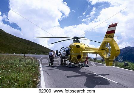 Rescue doctors standing near helicopter on road, Germany View Large Photo Image Stock Image - Rescue doctors standing near helicopter on road, Germany . Fotosearch