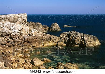Stock Image - Rock formation at coast, Portugal . Fotosearch