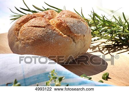 Stock Image - Round loaf of bread . Fotosearch