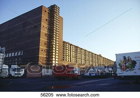 Row of semi-trucks parked in front of building, Hesse, Germany, Europe View Large Photo Image Stock Photography - Row of semi-trucks parked in front of building, Hesse, Germany, Europe . Fotosearch