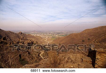Ruins on mountain overlooking valley, Peshawar, Pakistan View Large Photo Image Stock Image - Ruins on mountain overlooking valley, Peshawar, Pakistan . Fotosearch