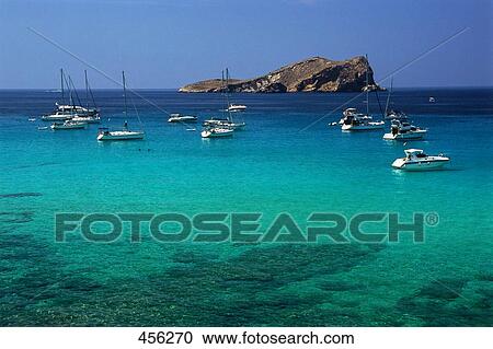 Sailboats moored at coast, Balearic Islands, Spain View Large Photo Image Stock Image - Sailboats moored at coast, Balearic Islands, Spain . Fotosearch
