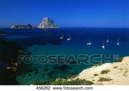 Sailboats moored near coast, Es Vedra, Balearic Islands, Spain View Large Photo Image Stock Image - Sailboats moored near coast, Es Vedra, Balearic Islands, Spain . Fotosearch