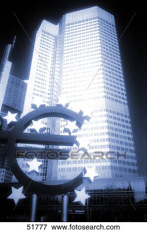 Sculpture of euro with bank in background, European Central Bank, Frankfurt, Hesse, Germany View Large Photo Image Stock Photo - Sculpture of euro with bank in background, European Central Bank, Frankfurt, Hesse, Germany . Fotosearch
