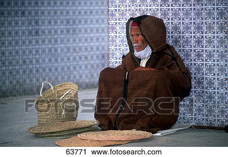 Senior man selling wicker craft products, Djerba, Tunisia View Large Photo Image Stock Image - Senior man selling wicker craft products, Djerba, Tunisia . Fotosearch
