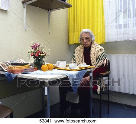 Senior woman eating breakfast View Large Photo Image Stock Image - Senior woman eating breakfast . Fotosearch