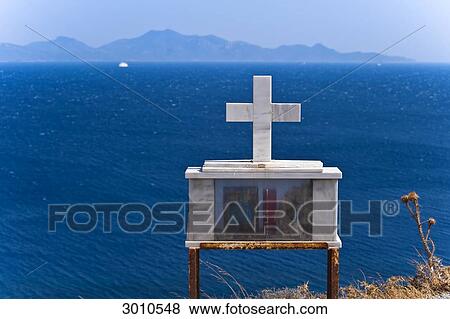 Shrine with cross on the steep coast of Cos, Greece View Large Photo Image Stock Photo - Shrine with cross on the steep coast of Cos, Greece . Fotosearch
