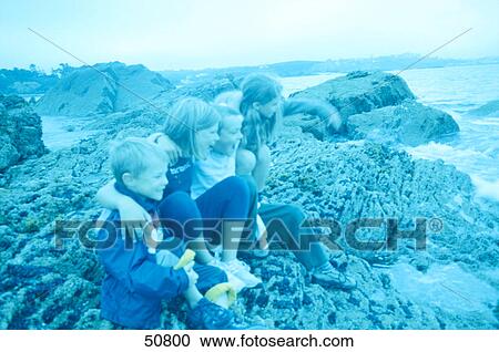 Side profile of group of children enjoying on beach View Large Photo Image Stock Image - Side profile of group of children enjoying on beach . Fotosearch