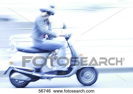 Stock Photograph - Side profile of woman riding motor scooter . Fotosearch