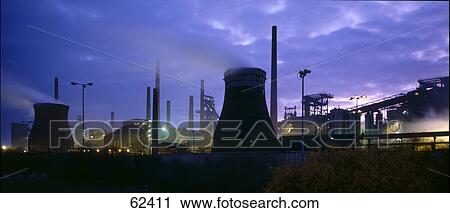 Stock Image - Silhouette of oil industry at dusk . Fotosearch