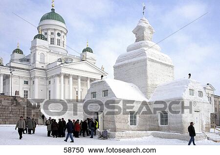 Stock Image - Snow covered buildings and cathedral, Helsinki, Finland . Fotosearch