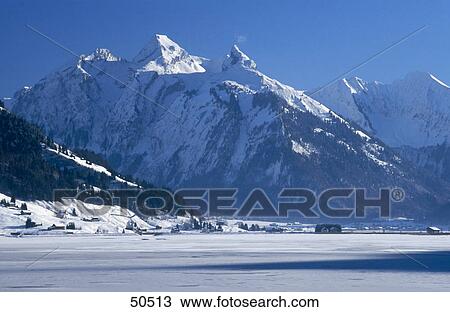 Stock Image - Snow covered mountains, Swiss Alps, Switzerland . Fotosearch