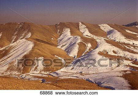 Stock Photo - Snow over mountain range, Hindukush Mountains, Afghanistan . Fotosearch