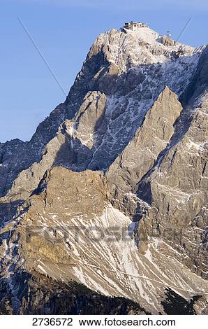 Snowcapped mountain under blue sky, Mt Zugspitze, Germany View Large Photo Image Stock Image - Snowcapped mountain under blue sky, Mt Zugspitze, Germany . Fotosearch