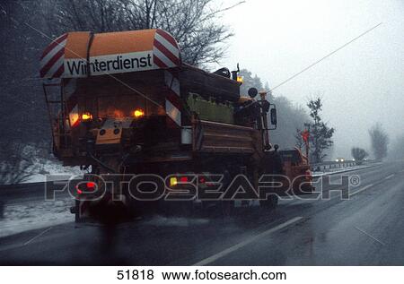 Snowplough cleaning road View Large Photo Image Stock Photo - Snowplough cleaning road . Fotosearch