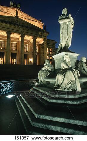Statues at fountain with concert hall in background, Schiller Fountain, Berlin, Germany View Large Photo Image Stock Photo - Statues at fountain with concert hall in background, Schiller Fountain, Berlin, Germany . Fotosearch