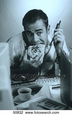 Stock Image - Stressed man in office . Fotosearch