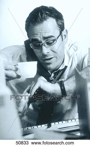 Stock Image - Stressed man in office . Fotosearch
