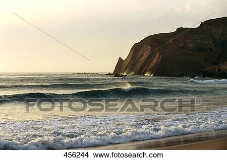 Surf with cliffs on beach, Algarve, Portugal View Large Photo Image Picture - Surf with cliffs on beach, Algarve, Portugal . Fotosearch