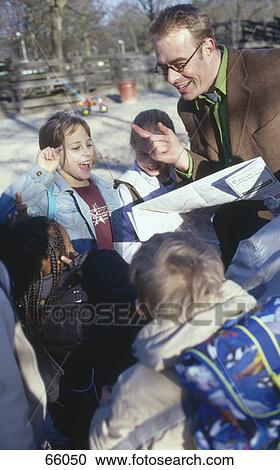 Teacher and school students smiling View Large Photo Image Stock Image - Teacher and school students smiling . Fotosearch
