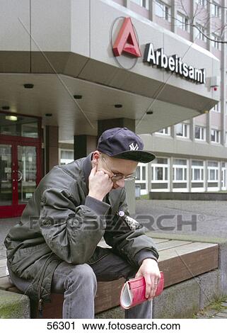 Teenager looking sad in front of employment service agency building View Large Photo Image Stock Image - Teenager looking sad in front of employment service agency building . Fotosearch