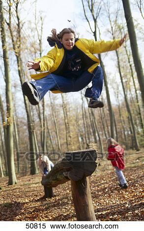 Stock Photography - Three children playing in playground . Fotosearch