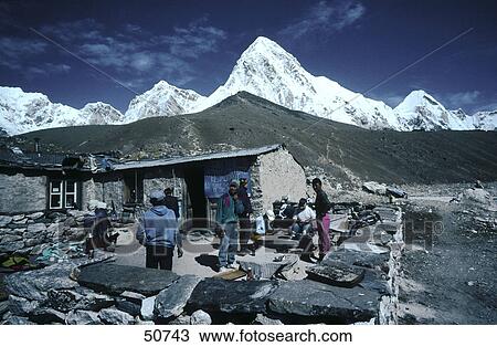 Tourist at lodge with mountains in background, Gorak Shep, Pumori, Kala Patthar, Himalayas, Nepal View Large Photo Image Stock Image - Tourist at lodge with mountains in background, Gorak Shep, Pumori, Kala Patthar, Himalayas, Nepal . Fotosearch