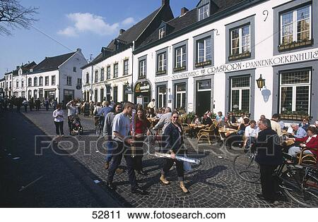 Stock Image - Tourists in city street, Thorn, Netherlands . Fotosearch
