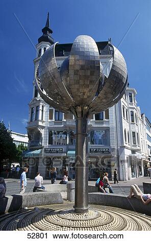 Stock Image - Tourists near fountain in town, Aachen, Germany . Fotosearch
