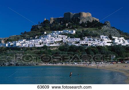Stock Photo - Tourists on beach, Rhodes, Dodecanese Islands, Greece . Fotosearch