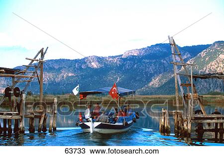 Tourists on boat in lake, Turkey View Large Photo Image Stock Image - Tourists on boat in lake, Turkey . Fotosearch