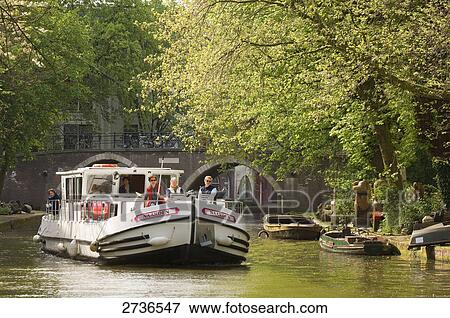Tourists on boat in river, Alte Gracht, Utrecht, Netherlands View Large Photo Image Stock Photo - Tourists on boat in river, Alte Gracht, Utrecht, Netherlands . Fotosearch