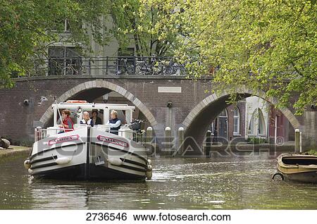 Tourists on boat in river, Alte Gracht, Utrecht, Netherlands View Large Photo Image Stock Photograph - Tourists on boat in river, Alte Gracht, Utrecht, Netherlands . Fotosearch