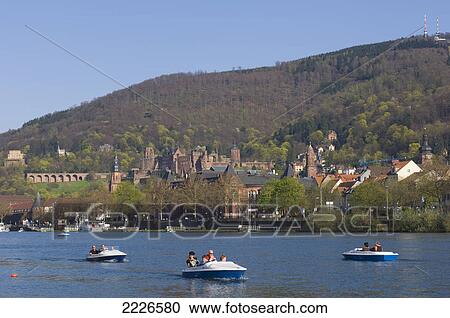 Stock Image - Tourists on paddleboats in river, RiverNeckar, Heidelberg, Baden-Wuerttemberg, Germany . Fotosearch