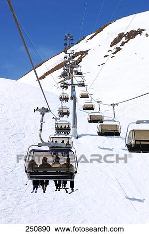 Tourists on ski lifts at ski resort, Austria View Large Photo Image Stock Image - Tourists on ski lifts at ski resort, Austria . Fotosearch