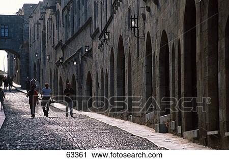 Tourists walking in street, Street Of The Knights, Rhodes, Dodecanese Islands, Greece View Large Photo Image Stock Image - Tourists walking in street, Street Of The Knights, Rhodes, Dodecanese Islands, Greece . Fotosearch