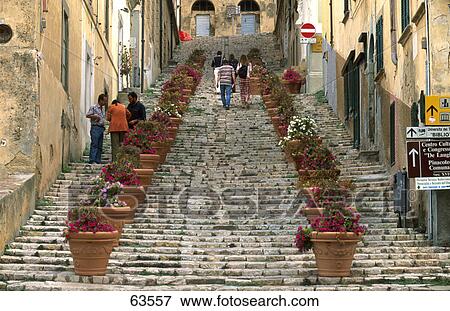 Tourists walking up stairs in street, Elba Island, Tuscany, Italy View Large Photo Image Stock Photo - Tourists walking up stairs in street, Elba Island, Tuscany, Italy . Fotosearch