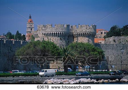 Stock Photo - Traffic on road in front of castle, Dodecanese Islands, Greece . Fotosearch