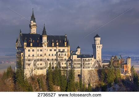 Stock Photo - Trees in front of castle, Neuschwanstein Castle, Allgaeu, Bavaria, Germany . Fotosearch