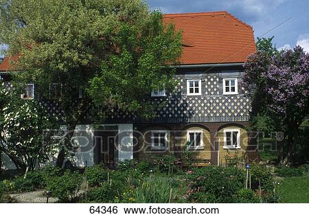 Trees near building, Obercunnersdorf, Goerlitz, Saxony, Germany View Large Photo Image Stock Photograph - Trees near building, Obercunnersdorf, Goerlitz, Saxony, Germany . Fotosearch
