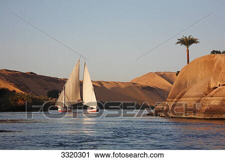 Two Feluccas on the Nil, Aswan, Egypt View Large Photo Image Stock Image - Two Feluccas on the Nil, Aswan, Egypt . Fotosearch