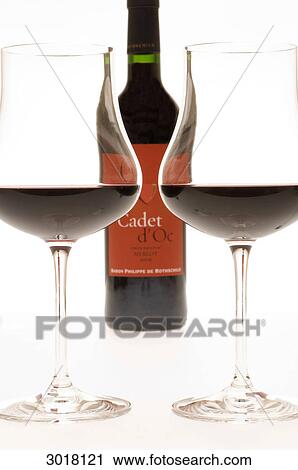 Two filled claret glasses in front of wine bottle, low angle view View Large Photo Image Stock Image - Two filled claret glasses in front of wine bottle, low angle view . Fotosearch