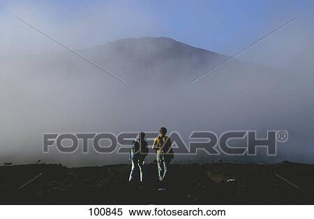 Two hikers on mountain, Reunion Island, France View Large Photo Image Stock Photography - Two hikers on mountain, Reunion Island, France . Fotosearch
