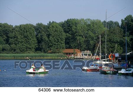 Two people boating in river, Schaalsee, Mecklenburg-Vorpommern, Germany View Large Photo Image Stock Photograph - Two people boating in river, Schaalsee, Mecklenburg-Vorpommern, Germany . Fotosearch