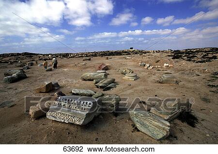 Two people on landscape scattered with old ruins View Large Photo Image Stock Image - Two people on landscape scattered with old ruins . Fotosearch