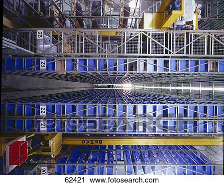 Two people working in warehouse View Large Photo Image Stock Image - Two people working in warehouse . Fotosearch